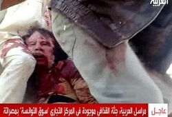 Оскверненное тело Каддафи тайно похоронили в пустыне