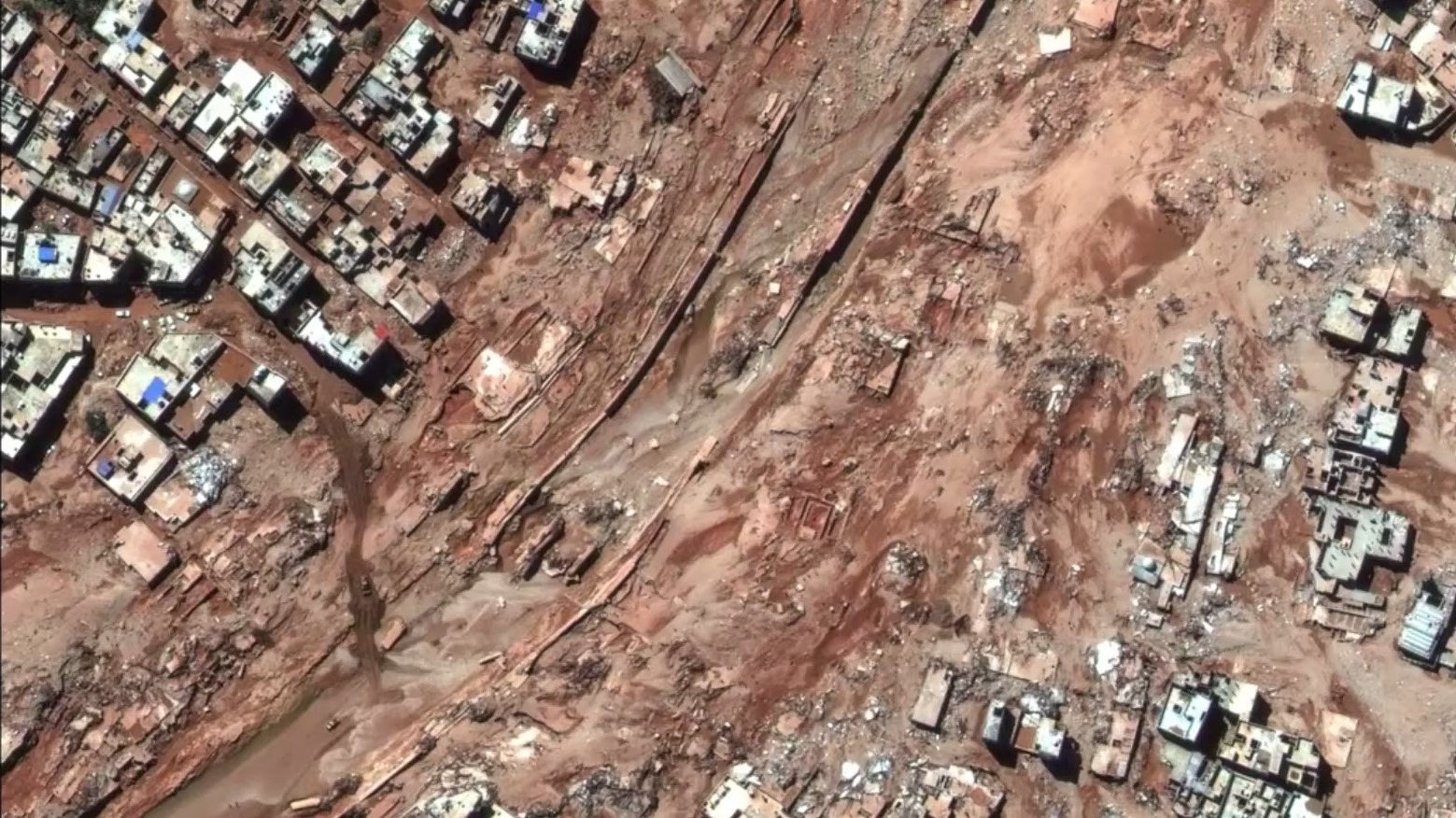 Спутниковый снимок, показывающий последствия катастрофического наводнения в ливийском городе Дерна